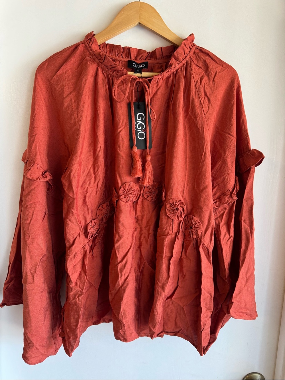 NWT GiGio boho rosette-accented ruffle peasant blouse in a rust/burnt orange.
